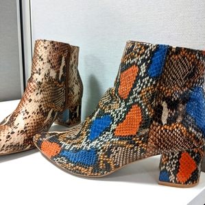Trendy snakeskin booties